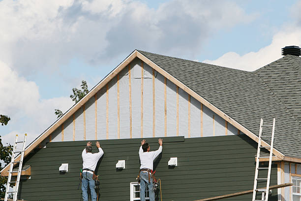 Professional Emergency Siding Repair technician working in Ashville, OH